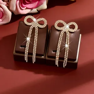 Elegant rhinestone bow long tassel earrings for women, sparkling crystal chic party jewelry.