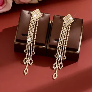 Luxury rhinestone long tassel earrings for women, sparkling diamond bow design fashion jewelry.
