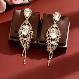 Elegant gold rhinestone dangle earrings with sparkling teardrop crystals and long tassels.