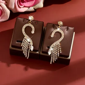 Elegant gold rhinestone tassel earrings, luxury crystal bird design fashion jewelry for women.