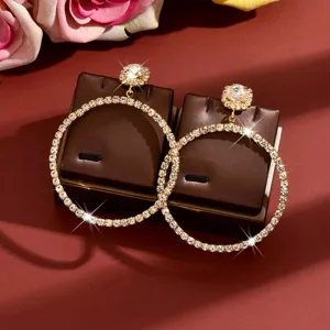 Luxury rhinestone hoop earrings with sparkling flower studs, elegant jewelry detail shot.