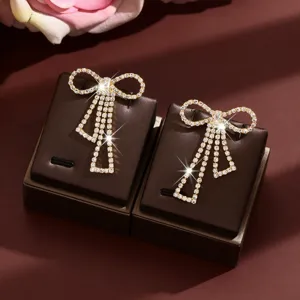 Rhinestone bow tassel earrings detail, elegant sparkling crystal design for daily fashion wear.