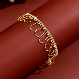 Gold rhinestone fringe chain anklet for women, sparkling crystal drop layered body jewelry.