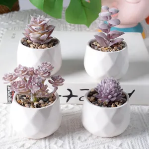 Set of four mini purple flocked artificial succulent plants in white geometric ceramic pots