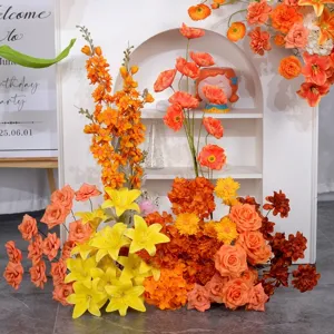Vibrant orange and yellow artificial flower arrangement for autumn wedding ceremony decor