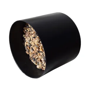 Black plastic flowerpot filled with decorative pebbles for artificial plants setup.