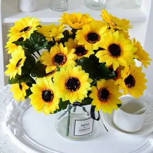 Vibrant yellow artificial sunflower bouquet in glass vase for home and wedding decor