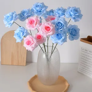 Elegant artificial blue and pink roses in a textured glass vase for wedding and home decor