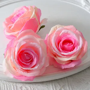 Artificial rose flower heads for wedding decoration, arch floral arrangement and party.