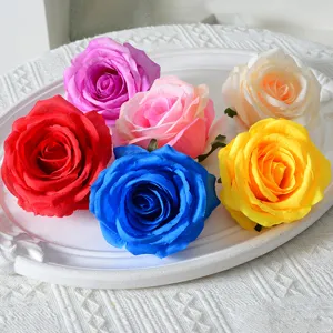 Artificial large rose flower heads for wedding decoration, arch, and floral arrangement supply.