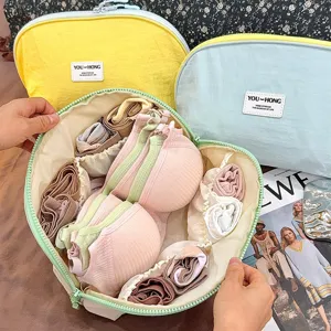 Detailed view of the portable underwear and bra organizer bag with multiple compartments.