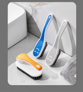 Closeup of multi-functional household cleaning brushes with soft bristles and colorful handles.