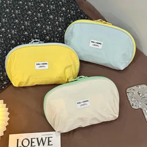 Portable 3-in-1 underwear and travel storage pouch set in multiple pastel colors detail.
