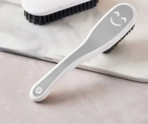 Multifunctional cleaning brush with soft bristles and ergonomic long handle for washing shoes.