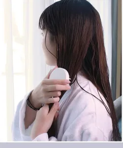 Round scalp massage shampoo brush for hair washing, comfortable head care tool detail.