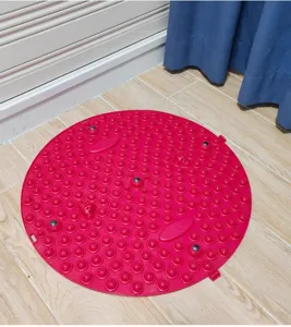Round acupressure mat for foot massage and reflexology, durable silicone material home use.