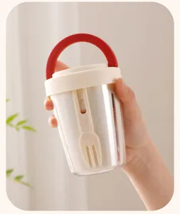 Portable double layer fruit salad cup detail close-up, convenient food container.