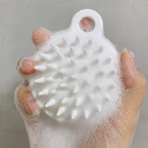 Silicone scalp massage brush for hair washing, soft bristle shampoo scrubber tool for deep cleansing.