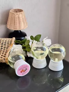 Inverted aroma diffuser ball with sweet peach scent, 300ml liquid capacity for home use.