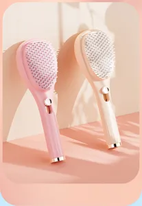 Spazzola per capelli retrattile con cuscino d'aria per districare, massaggiare e pulire facilmente.