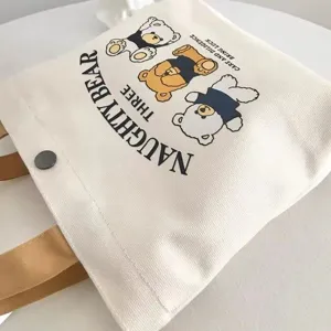 Close-up of the cute bear print canvas tote bag, showing fine fabric texture and neat details.