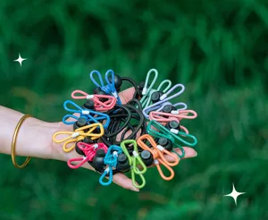 Portable travel clothesline with multi-color clips, windproof elastic outdoor drying rope.