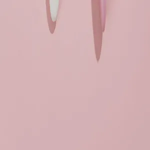 Long handled bath brush detail view showing the white and pink soft bristle designs.