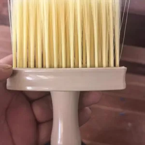 Close-up of the soft bristle cleaning brush for window grooves and narrow gaps.