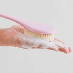 Long handle soft bristle bath body brush for back scrubbing and comfortable shower use.