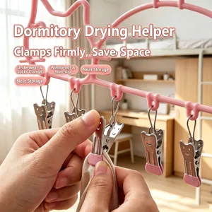 Multifunctional pink drying rack with smiling clips for socks and underwear in a dormitory