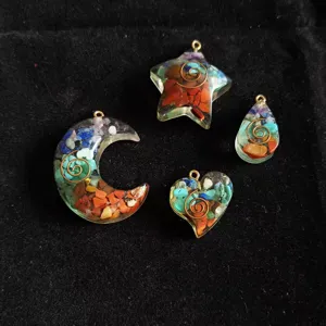 Detailed view of colorful crystal stone resin pendants in star, moon, and heart shapes.