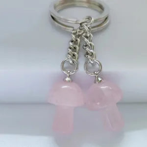 Crystal mushroom keychain detail, pink quartz double pendant charms with silver keyring.