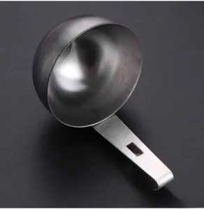 Stainless steel egg poacher spoon with handle for easy breakfast cooking and kitchen use.