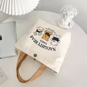 Cute canvas tote bag with bear print and sturdy handle, perfect for daily casual use.