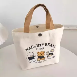 Small canvas tote bag with cute bear print and brown handles, perfect for daily portable use.