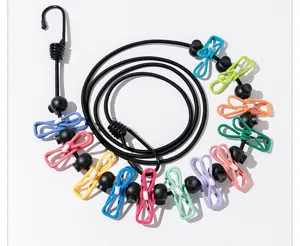 Portable travel clothesline with colorful clips, windproof elastic outdoor drying rope for hotel.