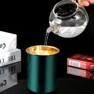 Stainless steel windproof ashtray with gold funnel insert, luxury green home decor.