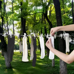 Portable outdoor travel clothesline with windproof clips, elastic design for use.