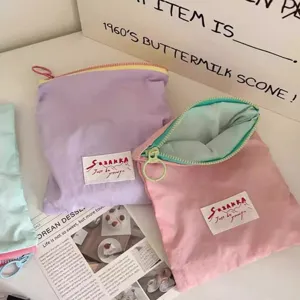 Portable macaron color block zipper pouch for makeup, cosmetics and lipstick daily storage.