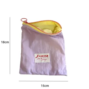 Macaron color-blocking portable cosmetic bag, stylish zipper makeup storage pouch for travel.