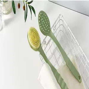 Long handled bath brush with double-sided design, soft bristles and massage dots for daily use.