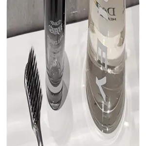 Transparent mouthwash cup toothbrush holder set with cleaning brush for modern bathroom decor.