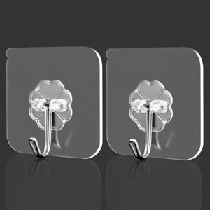 Ganchos de pared adhesivos transparentes resistentes sin marcas para cocina y baño.