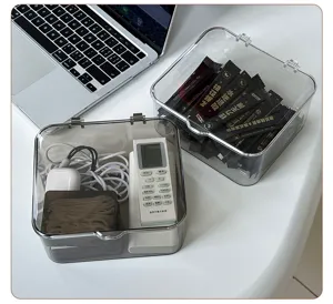 Detailed view of clear acrylic flip storage box showing large capacity and dust-proof design.