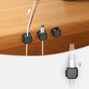 Magnetic cable organizer for desk and car, keeps charging cords neat and securely place.
