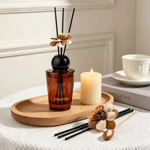 Brown retro reed diffuser set with wooden flower sticks and scented candle for home decor.