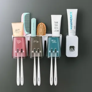 Set de soporte de cepillo de dientes de pared multifuncional con tazas y dispensador de pasta dental.
