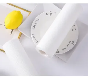 Detailed close-up of disposable kitchen cleaning paper rolls, showing soft textured surface.