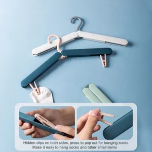 Portable foldable clothes hanger with hidden clips, multi-functional travel drying rack.