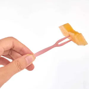 Disposable plastic fruit forks two-prong pink dessert cake snack picks for home daily use.
